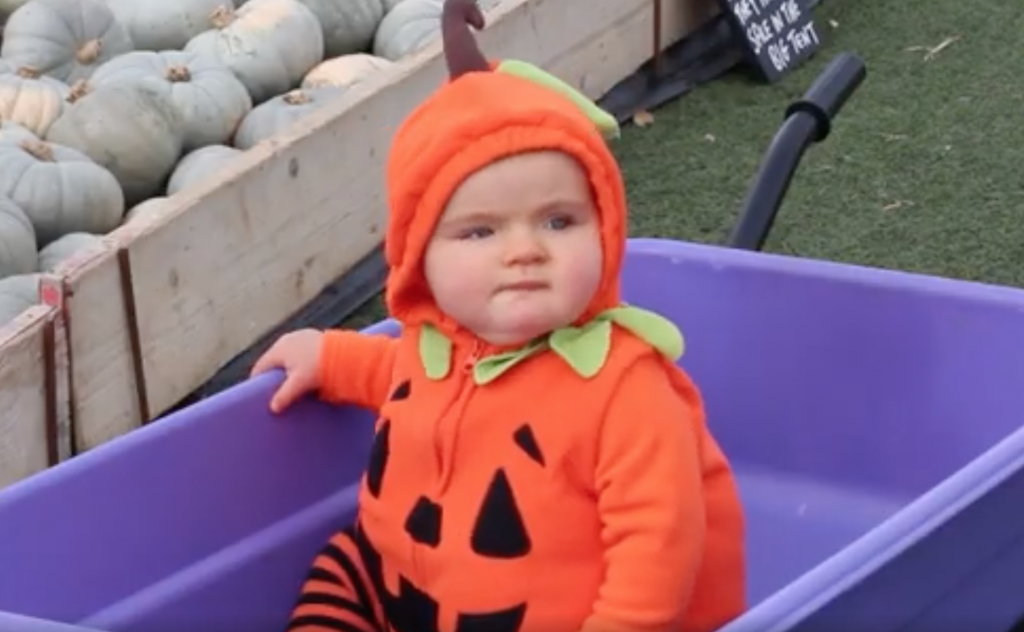 Baby in pumpkin outfit
